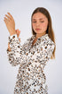 Leopard Print Basic Shirt featuring a classic button-down design, relaxed fit, and timeless animal print for a bold and versatile look.
