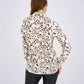 Leopard Print Basic Shirt featuring a classic button-down design, relaxed fit, and timeless animal print for a bold and versatile look.