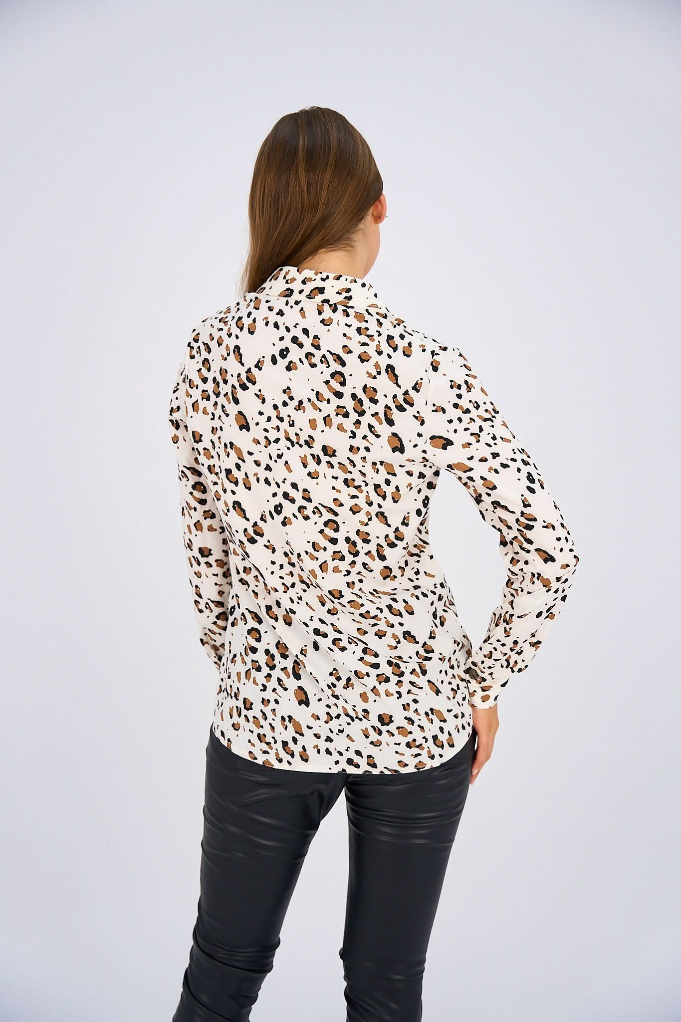 Leopard Print Basic Shirt featuring a classic button-down design, relaxed fit, and timeless animal print for a bold and versatile look.