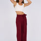 Burgundy Belted Wide-Leg Pants featuring a high-waisted fit, detachable belt, and flowing wide-leg silhouette for a sophisticated and modern look.
