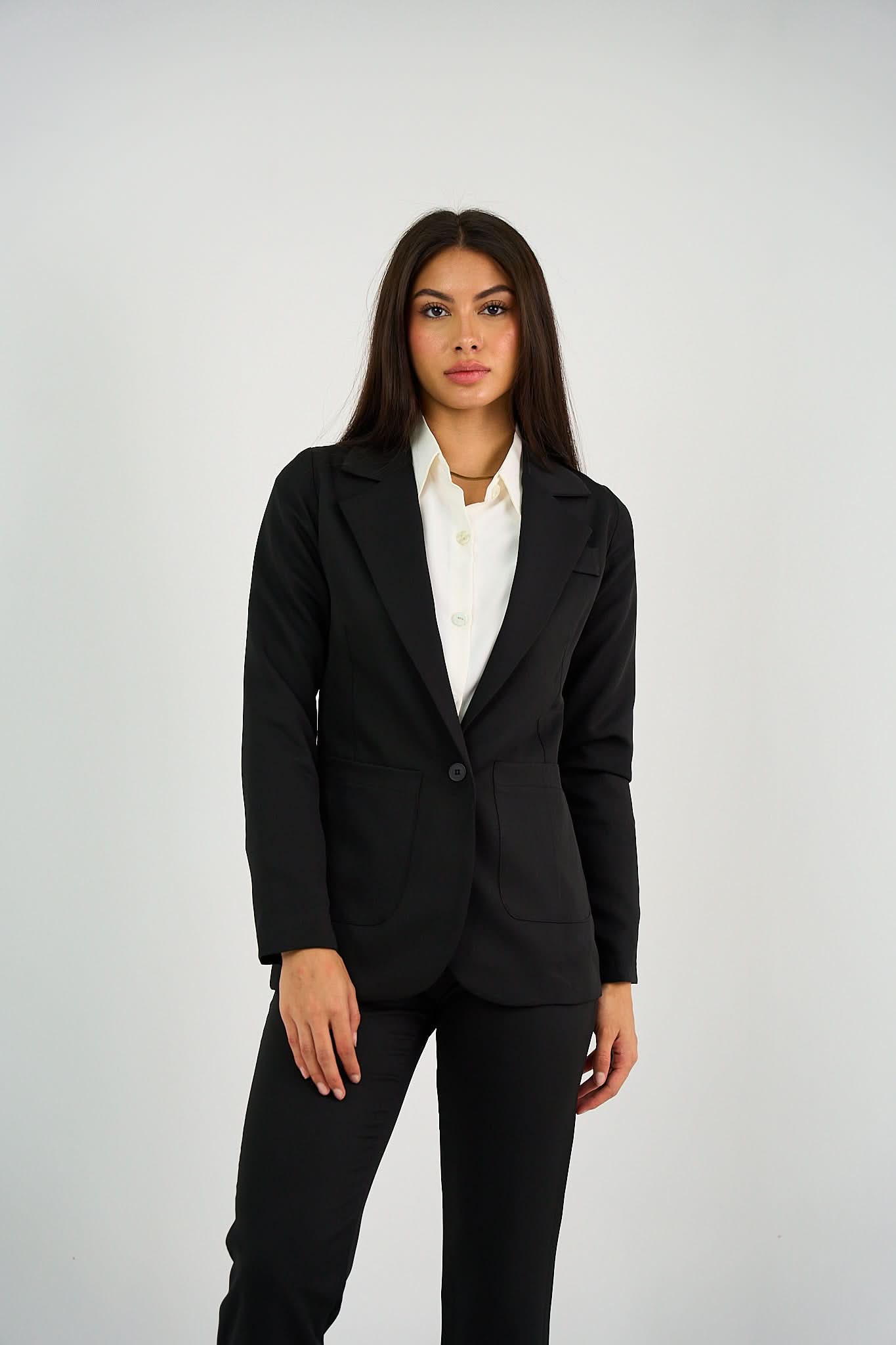 Black Single-Button Blazer featuring a structured fit, tailored silhouette, and a sleek single-button closure, perfect for office wear or smart-casual styling.