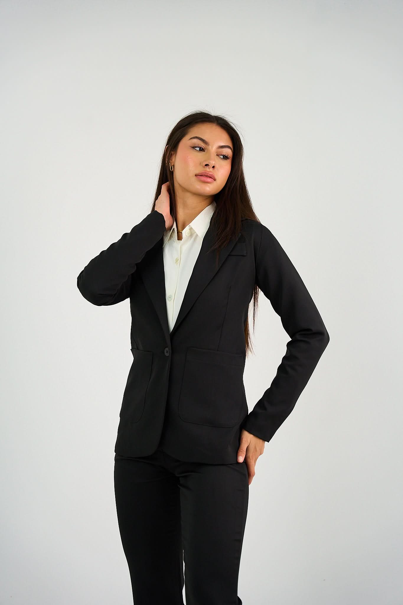 Black Single-Button Blazer featuring a structured fit, tailored silhouette, and a sleek single-button closure, perfect for office wear or smart-casual styling.